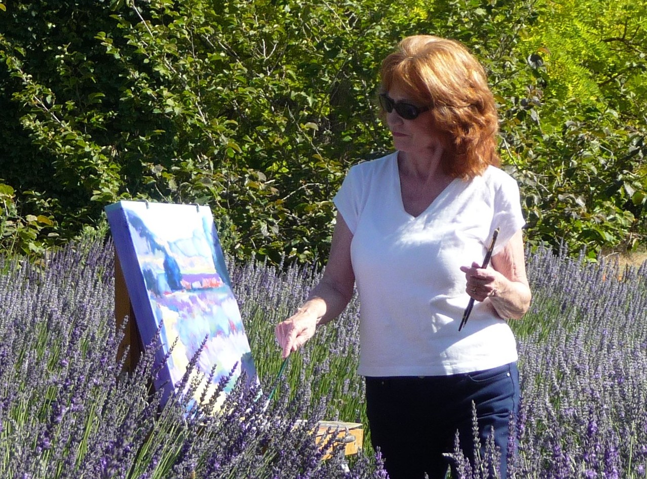 http://donnasfineart.com/Donna%20DeLaBriandais%2C%20painting%20in%20the%20Lavender%20field.JPG